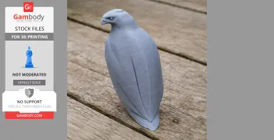 A gray 3D printed model of a hawk standing on wooden planks, showcasing smooth contours and detailed features.
