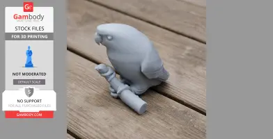 A 3D-printed figurine of a barred parakeet perched on a branch on a wooden surface.