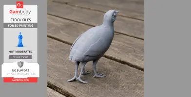 Gray 3D-printed model of Bartlett's tinamou, a bird, on a wooden surface.