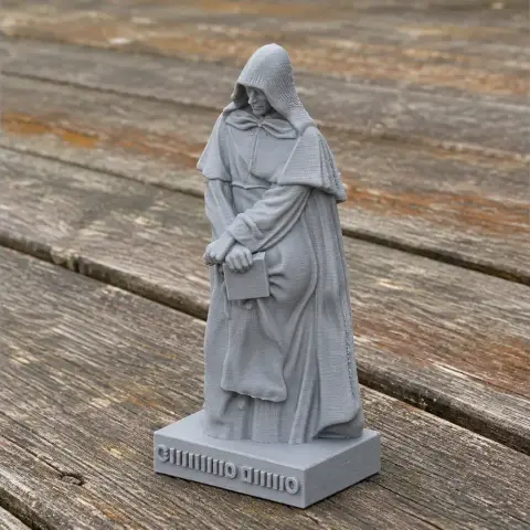 3D printed bust of a cloaked figure holding a book, standing on a base with text.