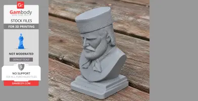 A gray 3D-printed bust of a bearded man with a hat, displayed on a wooden surface.