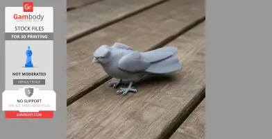Gray 3D-printed falcon model with detailed feathers on wooden surface.