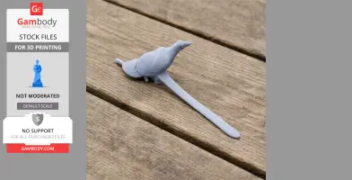 Gray 3D-printed model of a bird with a long tail on a wooden surface.