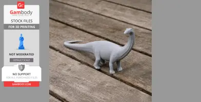 A gray 3D printed model of a Baurutitan dinosaur on a wooden surface.