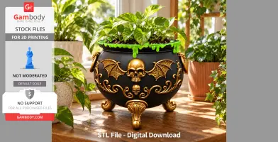 Black cauldron with gold skull and bat wing designs, green ooze detail, used as a plant holder.