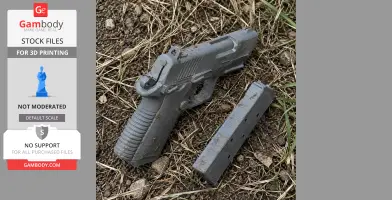 A gray 3D-printed Colt Mustang XSP prop and magazine on dirt and grass.