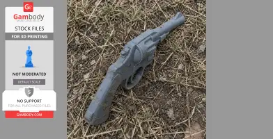 A 3D-printed replica of the Colt Official Police revolver prop resting on dry grass.