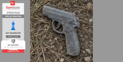 A 3D printed Makarov PM pistol prop, lying on dirt and grass.