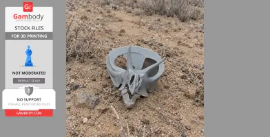 A 3D-printed Lepidocheirosaurus skull replica on sandy ground with dry grass.