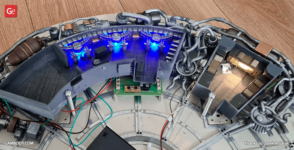 Detailed Millennium Falcon interior model with lit sections and visible wiring for 3D printing setup.