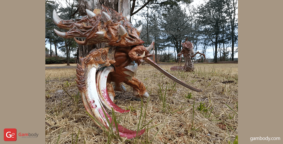 A detailed 3D-printed Ultralisk model from StarCraft, depicted in a natural outdoor setting.