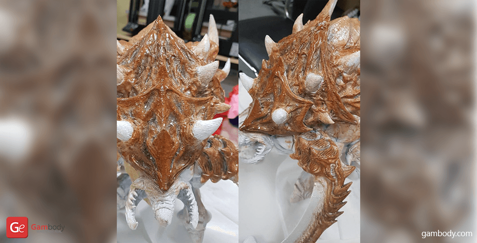Detailed 3D printed model of a StarCraft Ultralisk with textured, spiked armor and tusks.