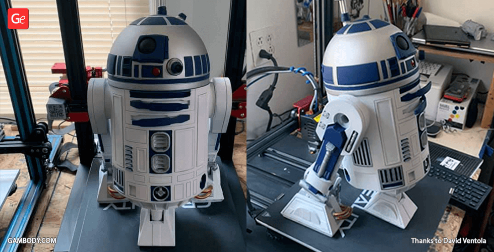 A 3D printed model of R2-D2 in progress on a 3D printer setup.
