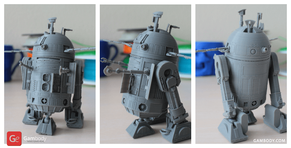 Gray 3D-printed R2-D2 model with detailed features, shown from three angles.