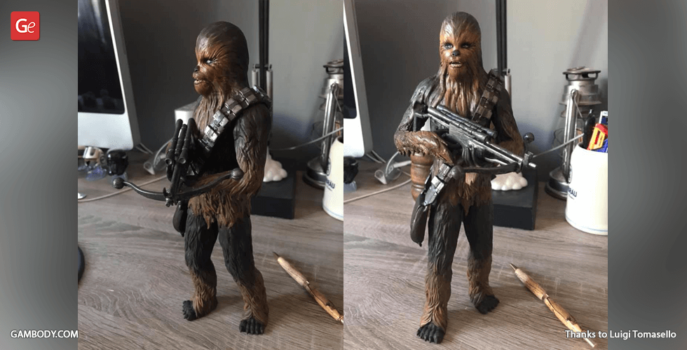 3D-printed model of a tall, furry creature with a bandolier, holding a large weapon, displayed on a desk.